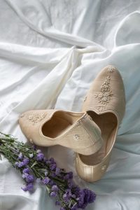 Intricate Hand-Embroidered Juttis in Fine Pressed Muga