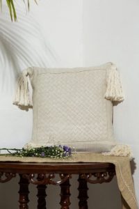 White Eri cushion with basket Weave border and knotted design